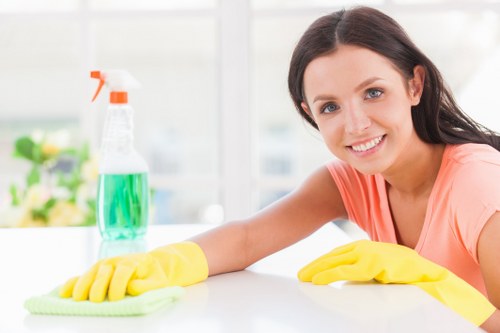 Professional oven cleaner in SW10 deep cleaning a kitchen oven