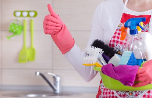 Local oven cleaning service in SW10 removing burnt grease from an oven