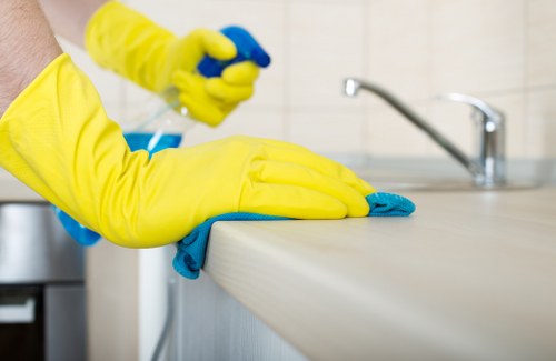 Cleaner using protective equipment during carpet cleaning