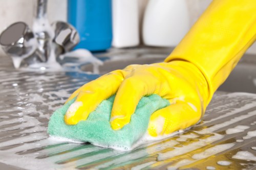 Professional house clearance service sorting items for recycling in SW10
